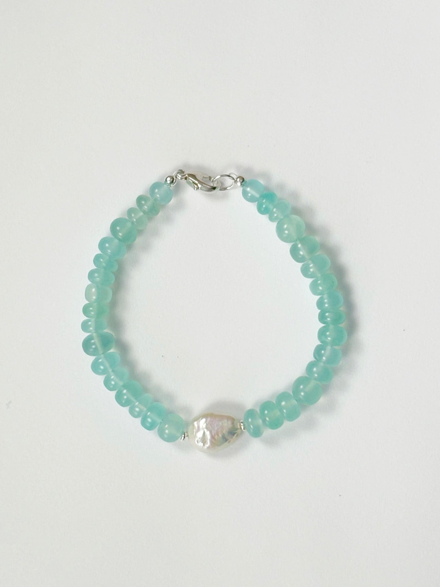 Chalcedony and Pearl Bracelet with light blue beads and a single white baroque pearl