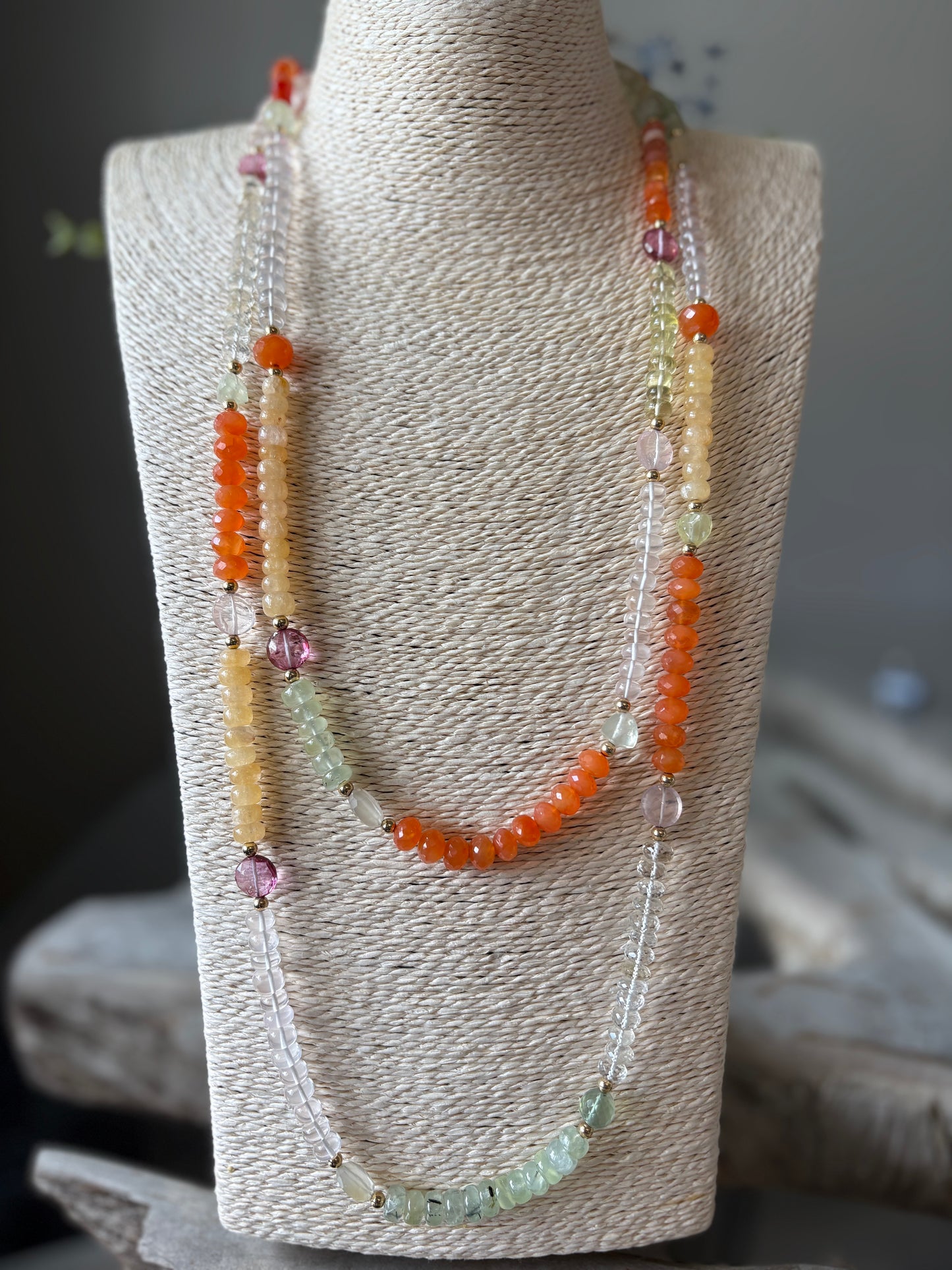 Multi Gemstone Necklace on a display stand
