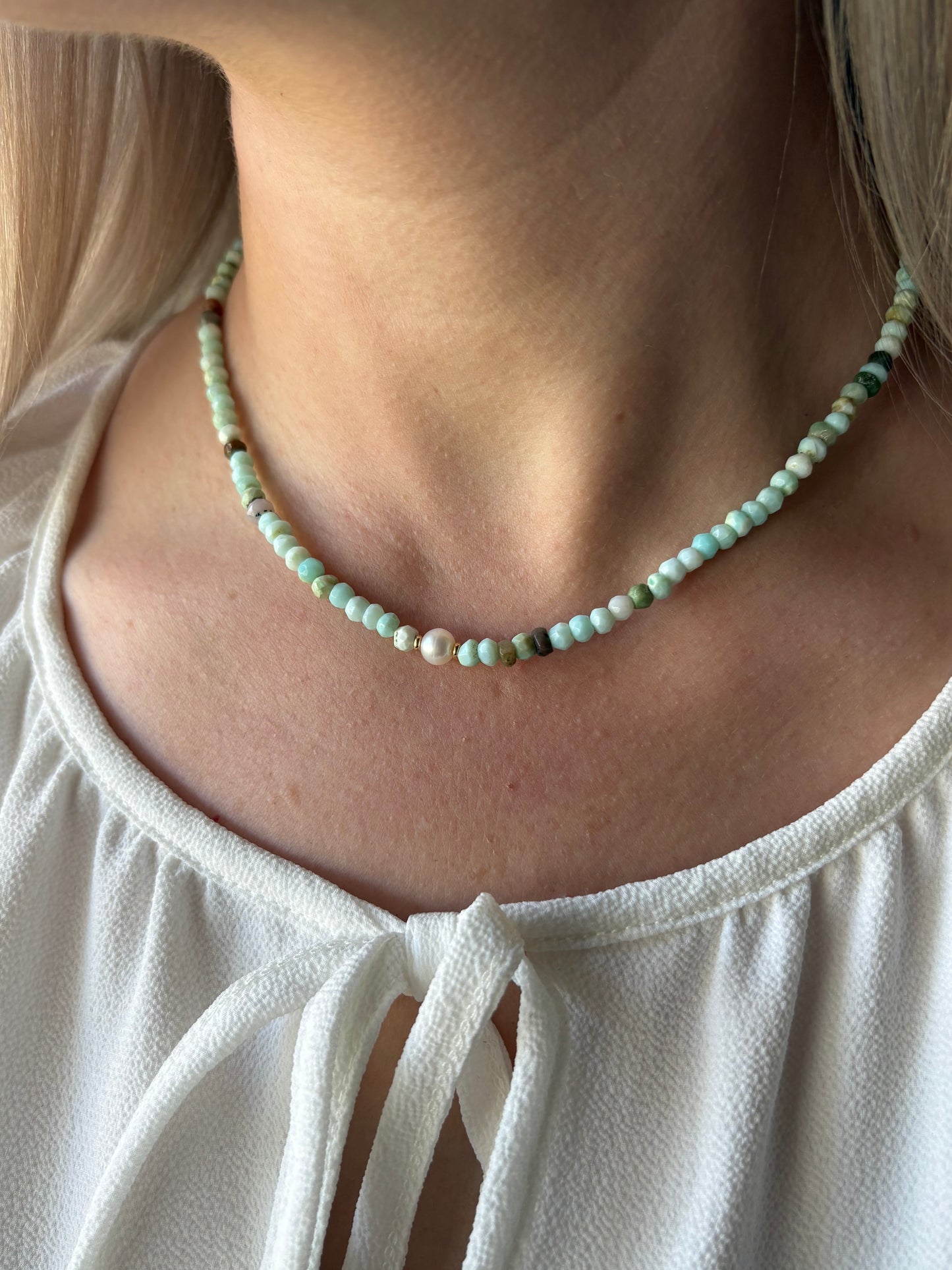 Peruvian Opal Pearl Choker 14 inch necklace on a person's neck