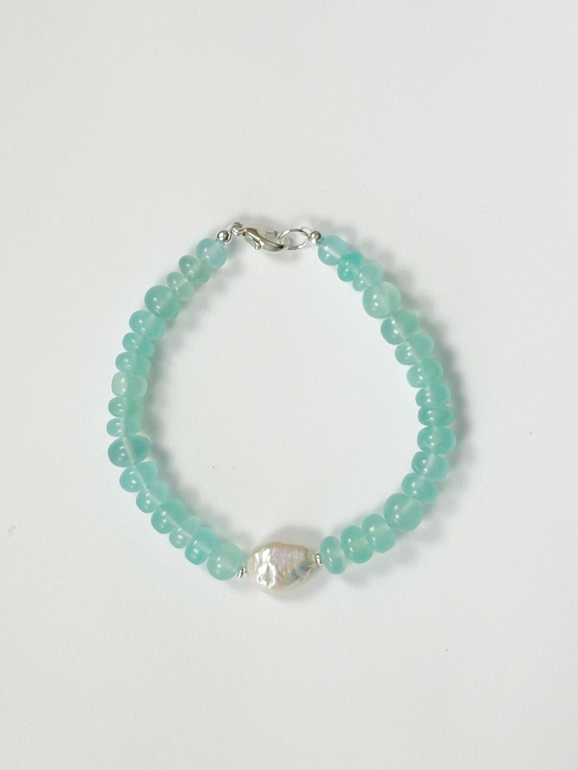 Chalcedony and Pearl Bracelet with light blue beads and a single white baroque pearl