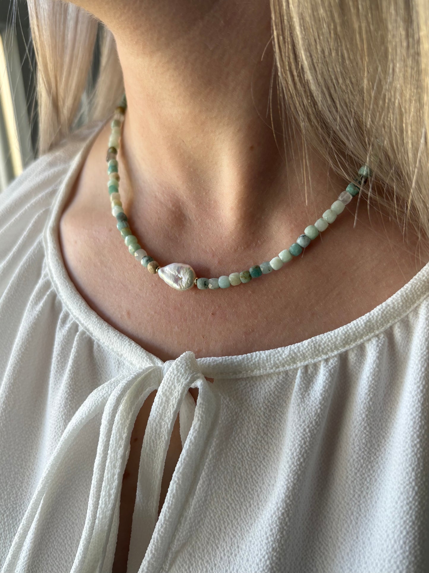 Amazonite Cube Pearl Necklace on a person with blonde hair and a white top