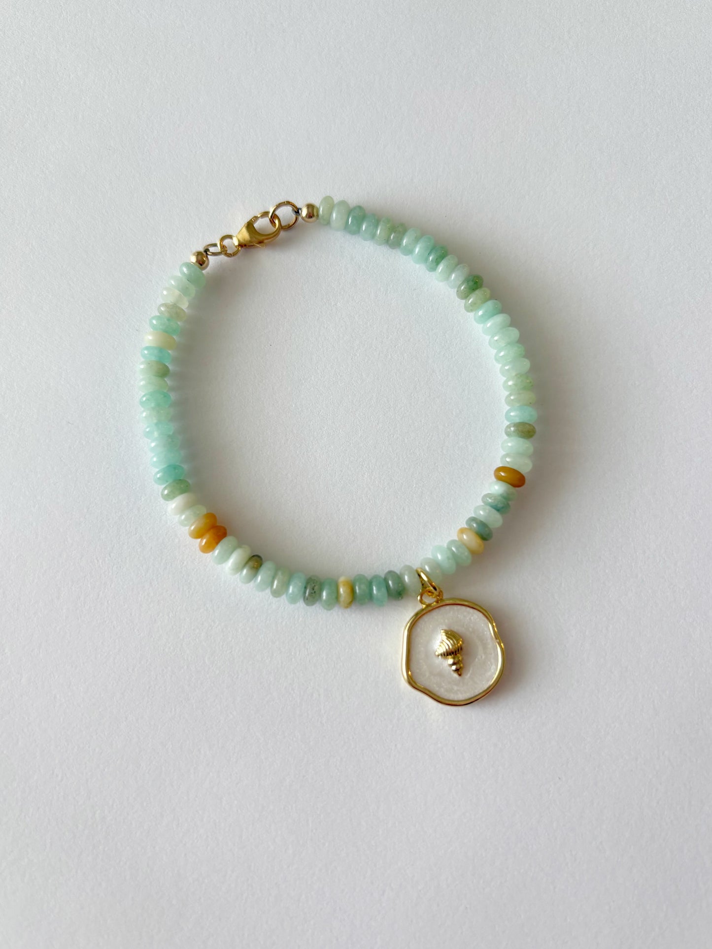 Amazonite and Shell Charm Bracelet with light blue and yellow beads and a gold shell charm
