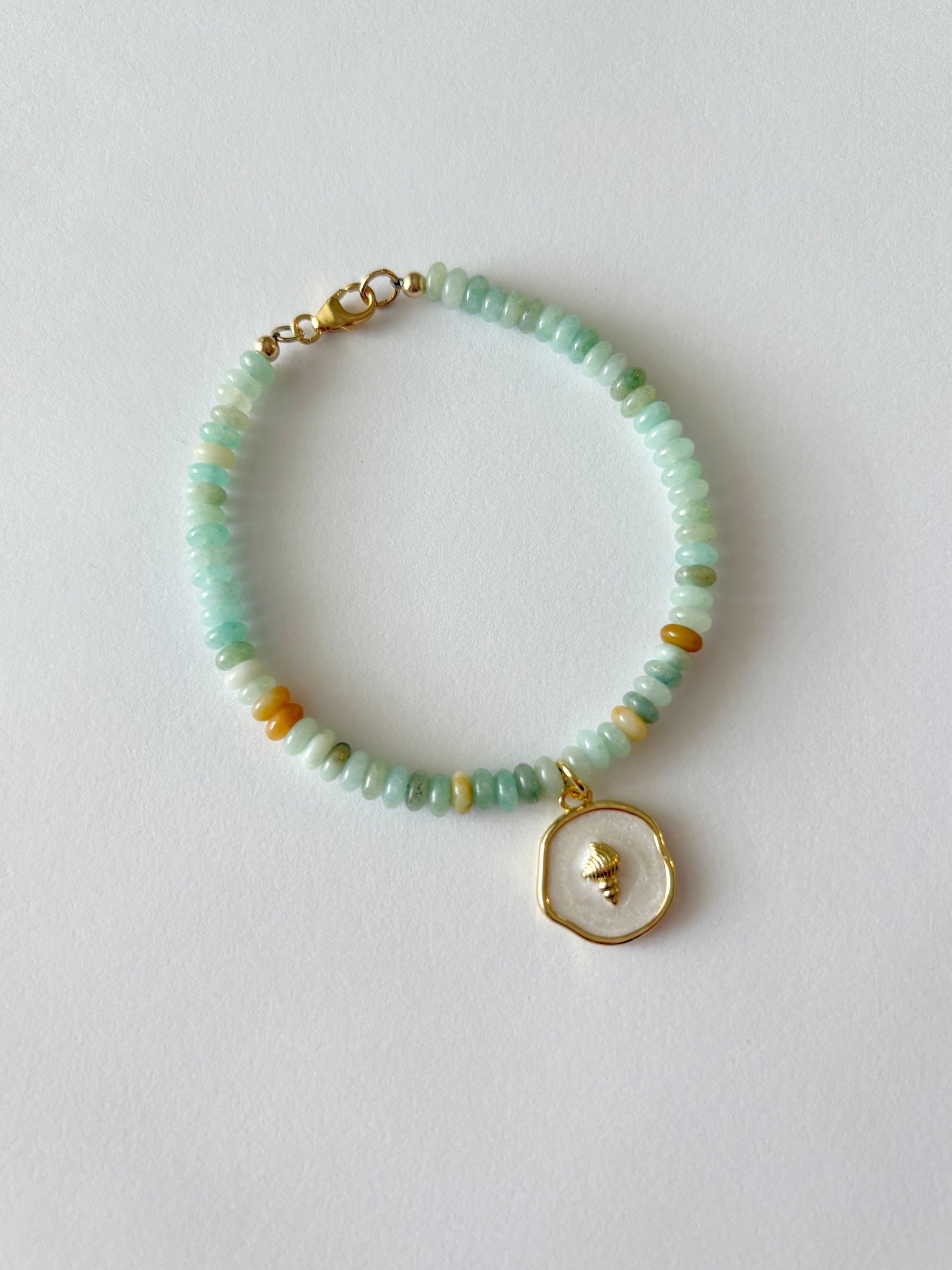 Amazonite and Shell Charm Bracelet with light blue and yellow beads and a gold shell charm