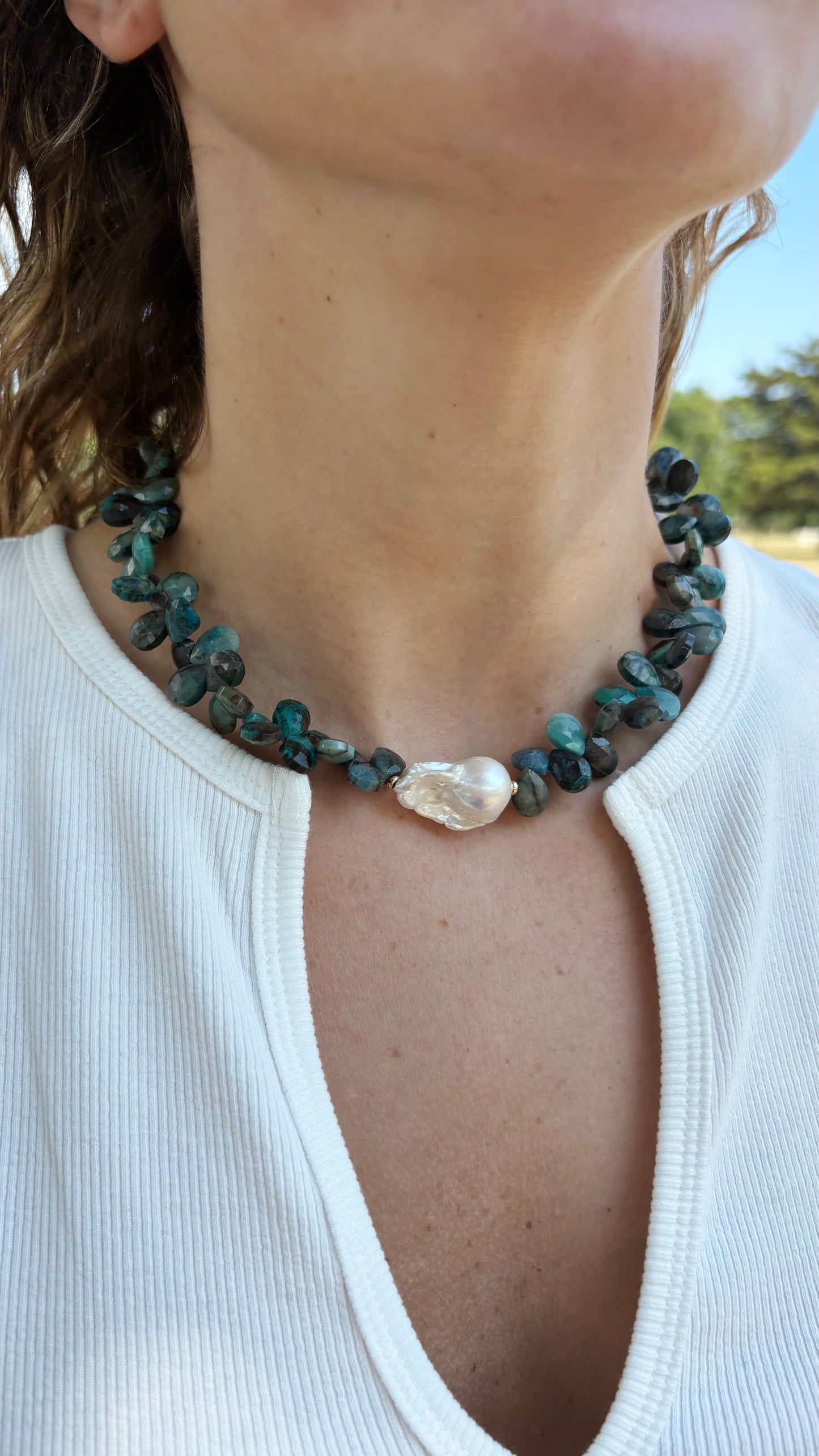 Chrysocolla Pearl Necklace featuring blue green faceted stones and a central white baroque pearl