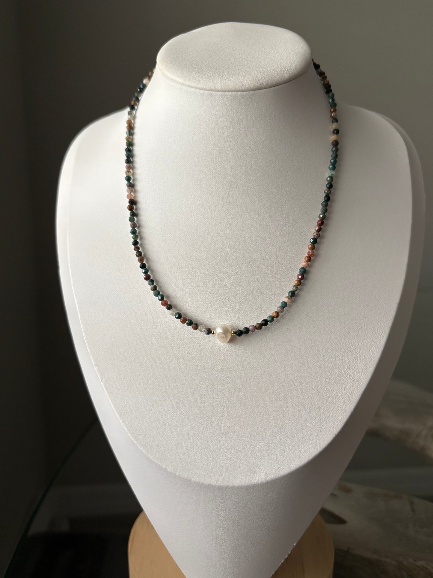 Indian Agate and Pearl Necklace on a white display bust