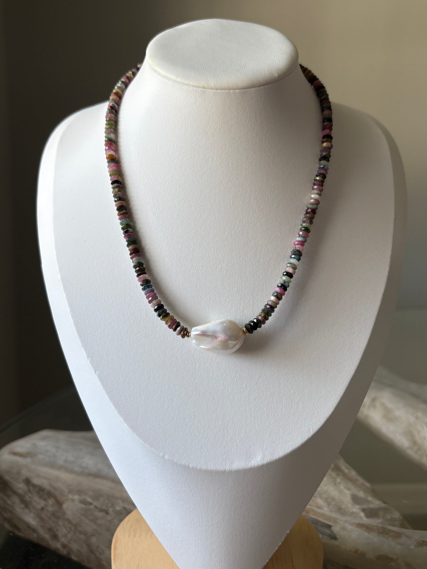 Tourmaline and Pearl Necklace on a white display stand