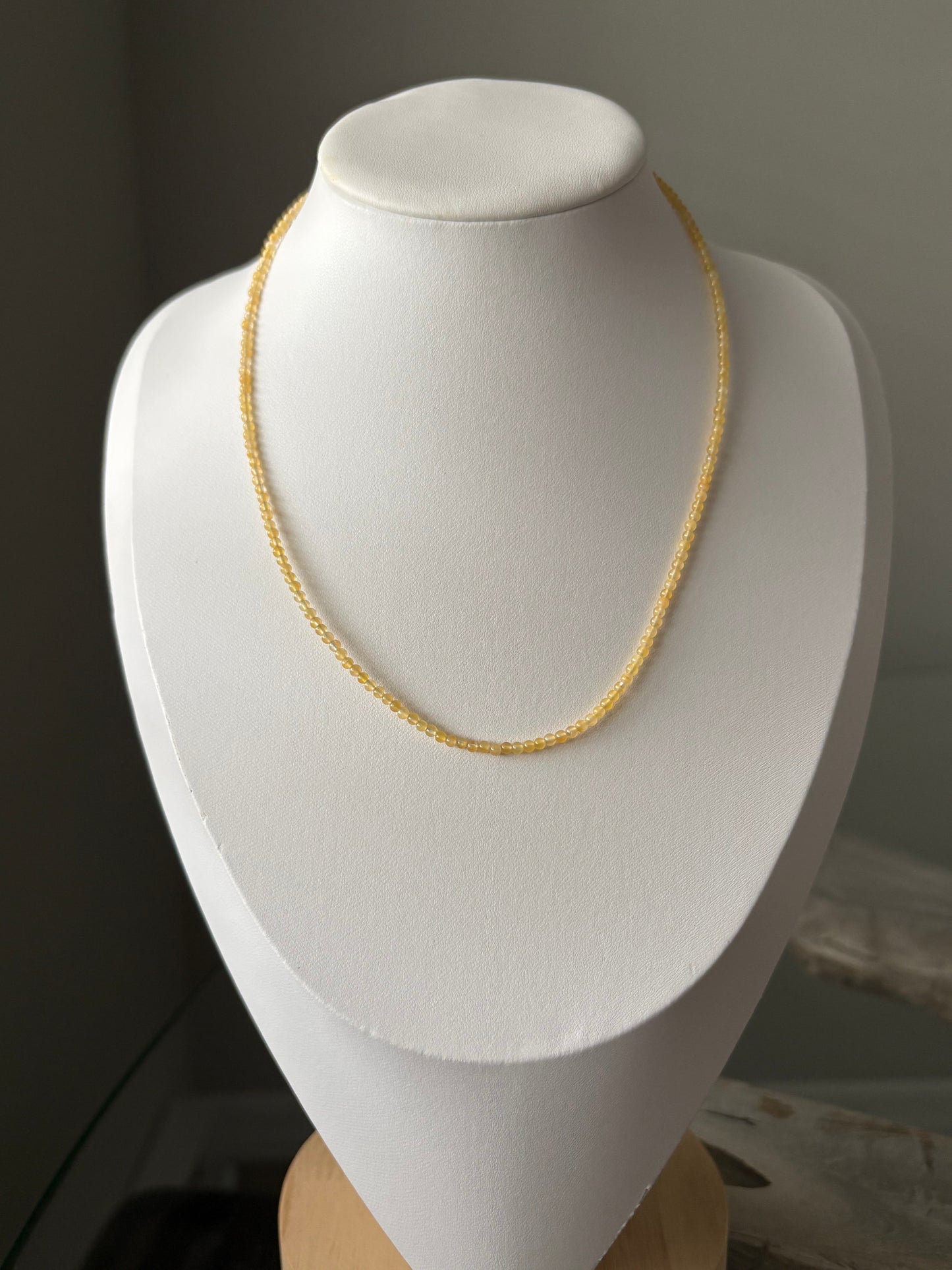 Yellow Aventurine Necklace displayed on a white bust