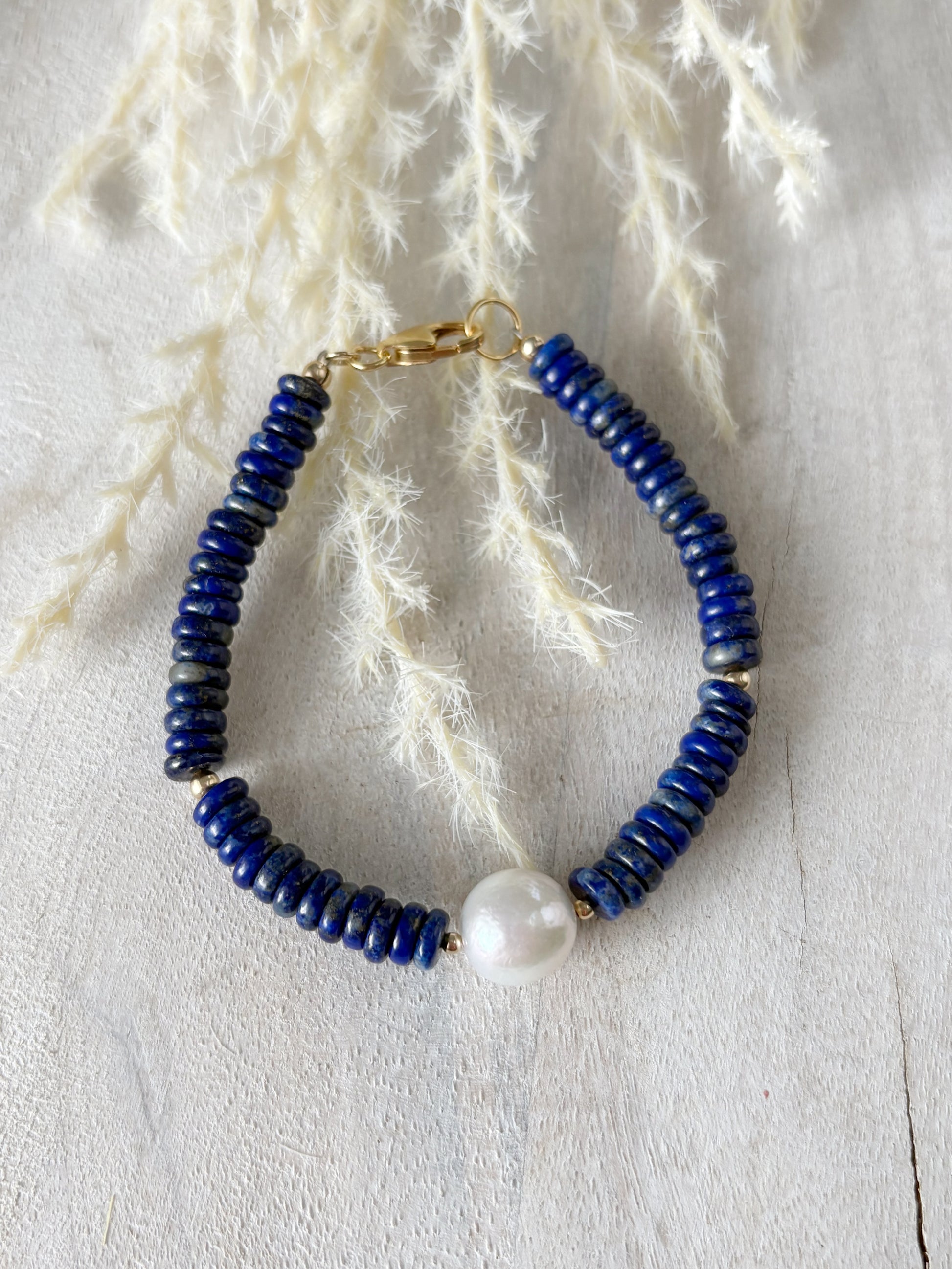 Lapis and Pearl Bracelet with blue lapis beads and a single white pearl
