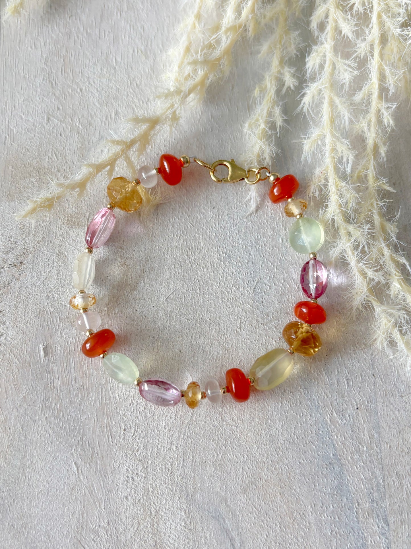 Multi Gemstone Bracelet 7 inch with various colored beads and a gold clasp