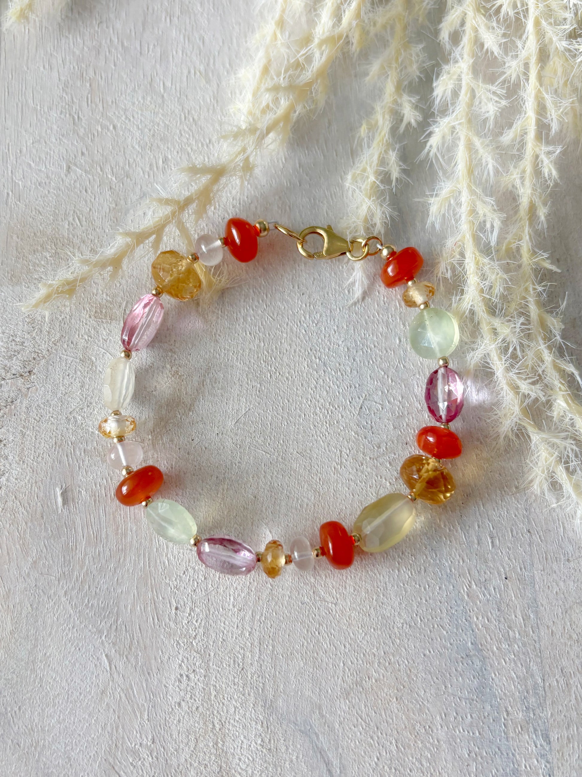 Multi Gemstone Bracelet 7 inch with various colored beads and a gold clasp